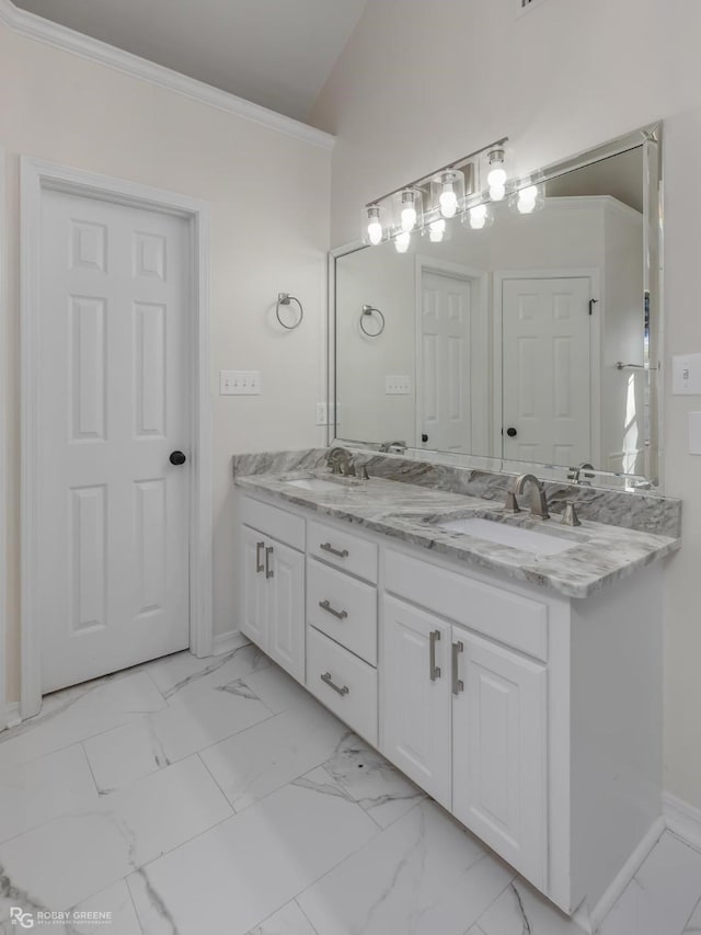 bathroom featuring ornamental molding and vanity