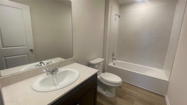 full bathroom featuring shower / washtub combination, toilet, vanity, and wood-type flooring