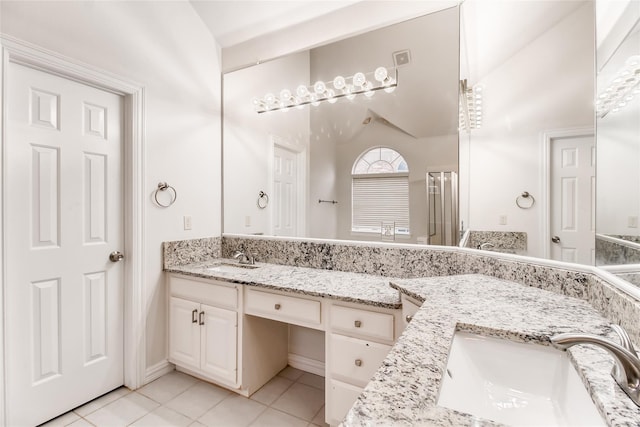 bathroom with tile patterned flooring and vanity