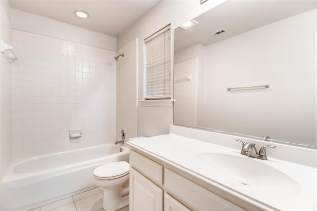 full bathroom featuring tiled shower / bath, vanity, toilet, and tile patterned flooring