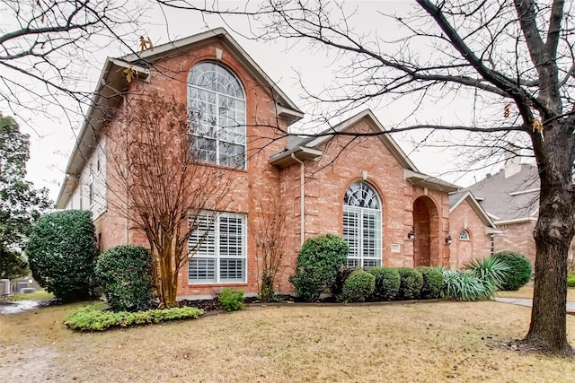 view of side of property with a yard