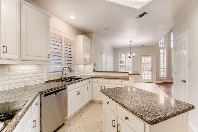 kitchen with sink, dishwasher, white cabinets, a kitchen island, and black electric cooktop