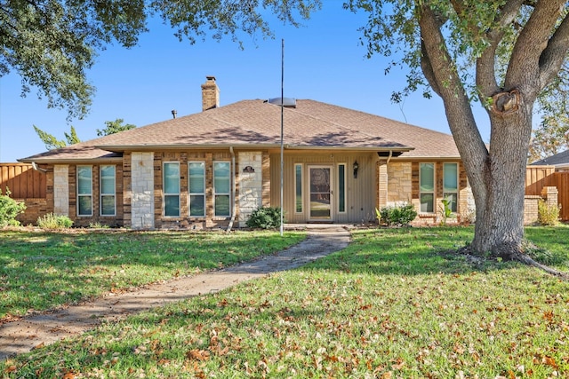 ranch-style home with a front yard