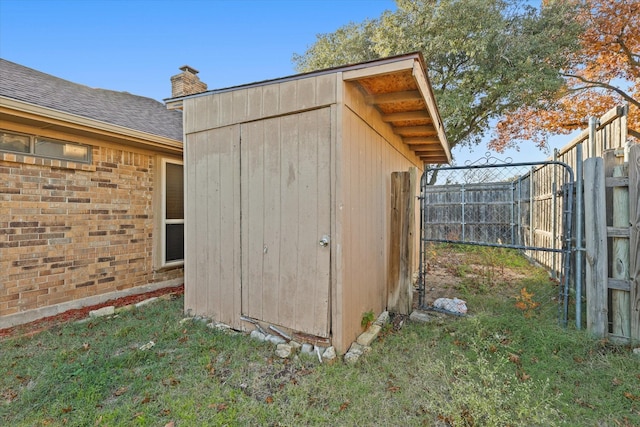 view of outbuilding featuring a yard