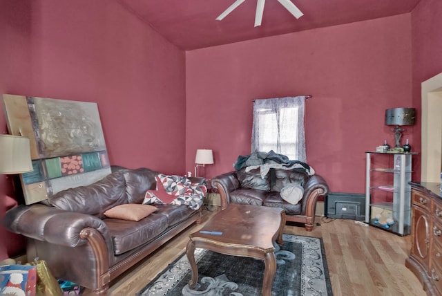 living room with light wood-type flooring and ceiling fan