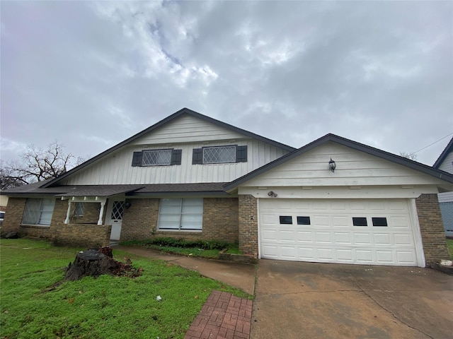 view of front of property with a garage and a front lawn