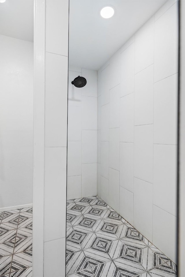 bathroom with tiled shower