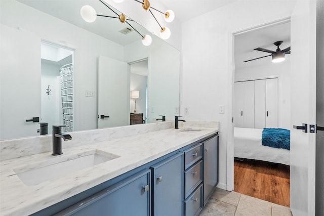 bathroom with tile patterned floors, ceiling fan, and vanity