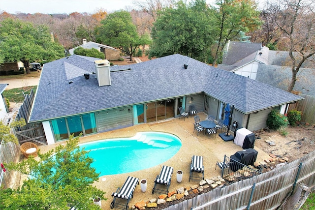 view of swimming pool with a patio, a fenced in pool, and a fenced backyard