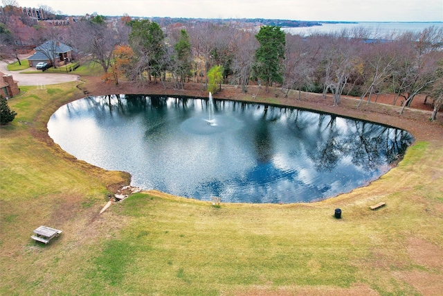 view of pool featuring a water view