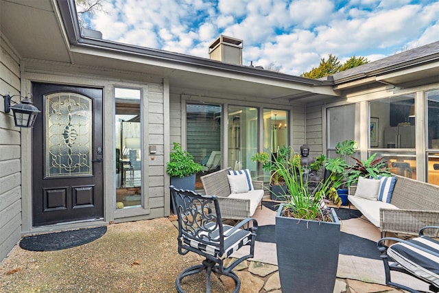 doorway to property featuring a patio and an outdoor hangout area