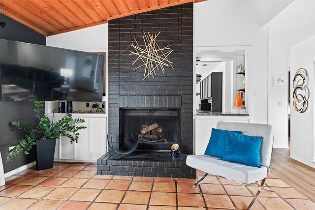 living room featuring lofted ceiling and wood ceiling