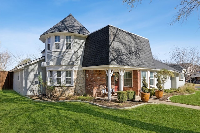 view of front of house featuring a front yard and a porch