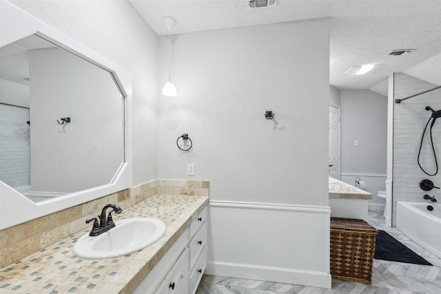 full bathroom with vanity, toilet, shower / bath combination, and a textured ceiling