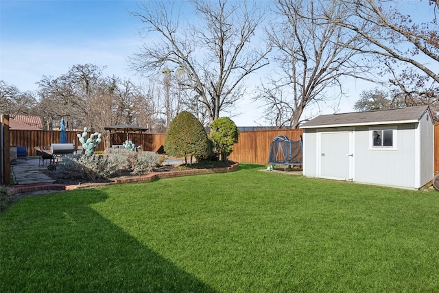 view of yard featuring a trampoline and a patio area