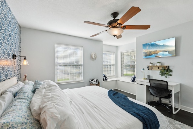 bedroom with hardwood / wood-style floors and ceiling fan