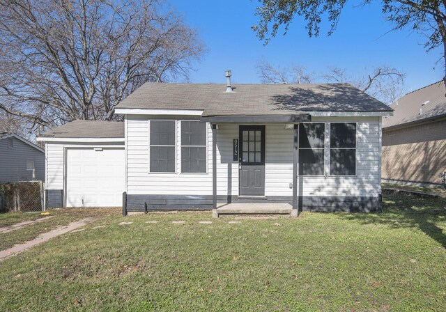 view of front of house with a porch, a garage, and a front lawn