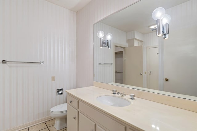 bathroom featuring vanity, toilet, and tile patterned flooring