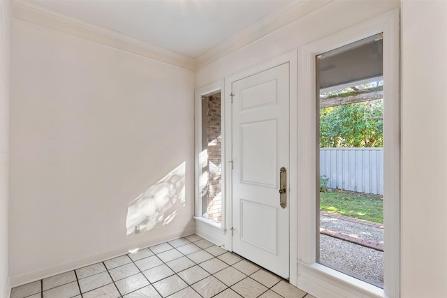 doorway with ornamental molding, plenty of natural light, and light tile patterned floors