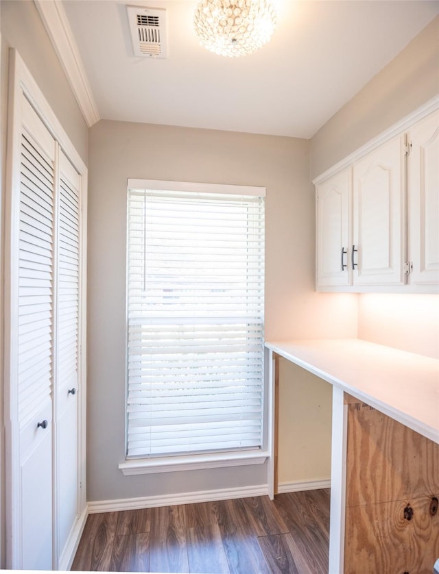 kitchen with white cabinetry and dark hardwood / wood-style floors