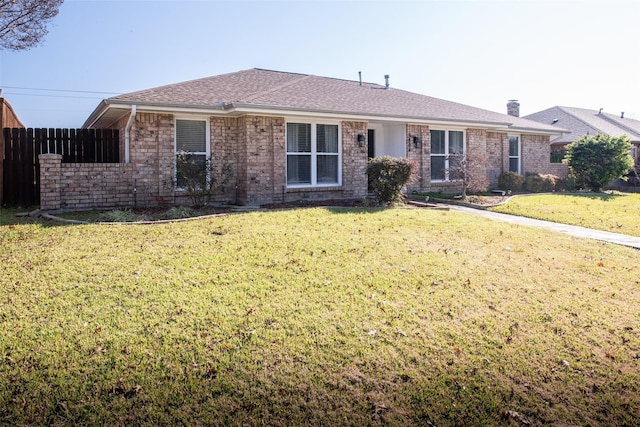 ranch-style home with a front yard