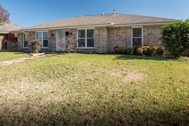 single story home with a front yard