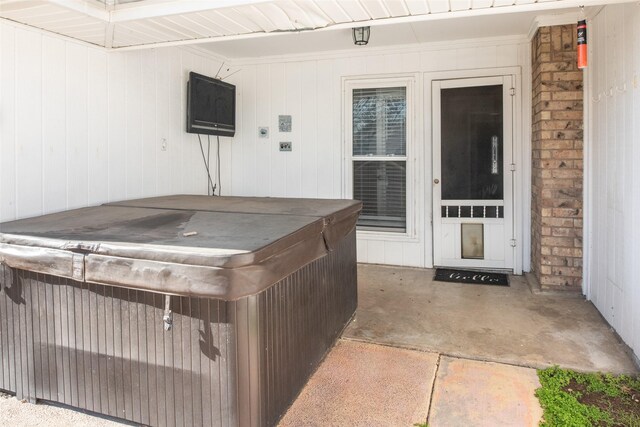 view of patio / terrace with a hot tub