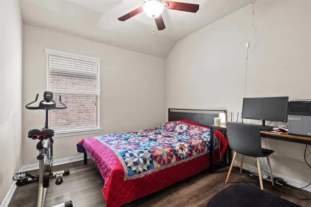 bedroom featuring ceiling fan, dark hardwood / wood-style floors, and lofted ceiling