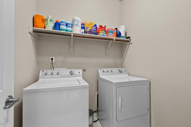 laundry room with washer and dryer