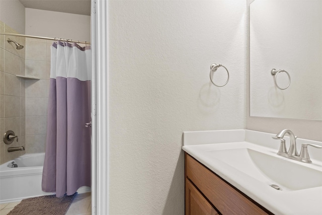 bathroom featuring tile patterned flooring, vanity, and shower / bath combination with curtain