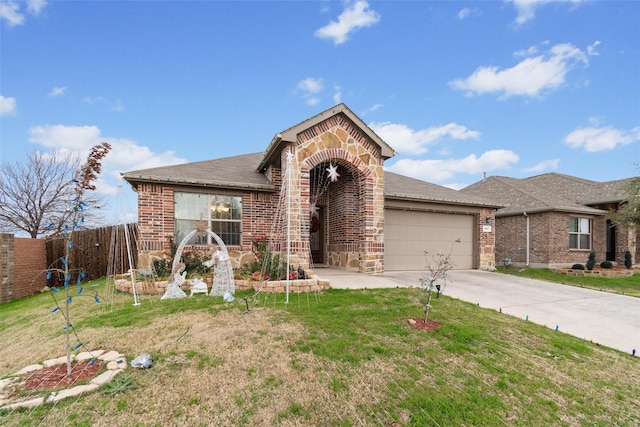 view of front of home featuring a front yard and a garage