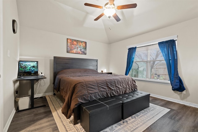 bedroom featuring dark hardwood / wood-style flooring, ceiling fan, and lofted ceiling