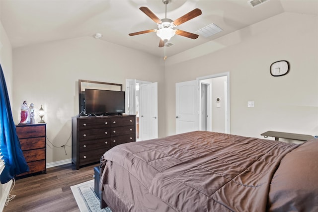 bedroom featuring ceiling fan, dark hardwood / wood-style flooring, and vaulted ceiling