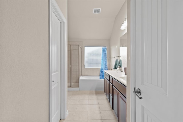 bathroom with tile patterned floors, vanity, lofted ceiling, and plus walk in shower