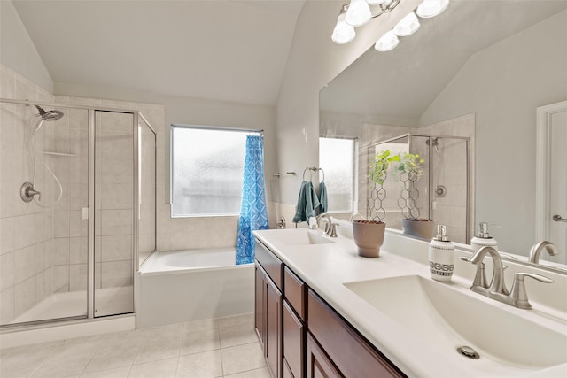 bathroom featuring tile patterned floors, vanity, vaulted ceiling, and separate shower and tub