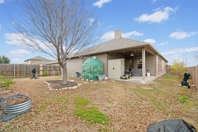 back of house featuring ceiling fan