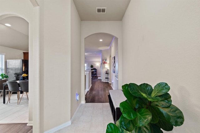 hallway featuring light tile patterned flooring