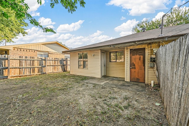 back of house with a patio area