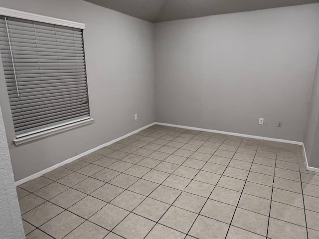 empty room featuring light tile patterned floors