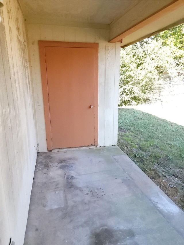 entrance to property featuring a patio area