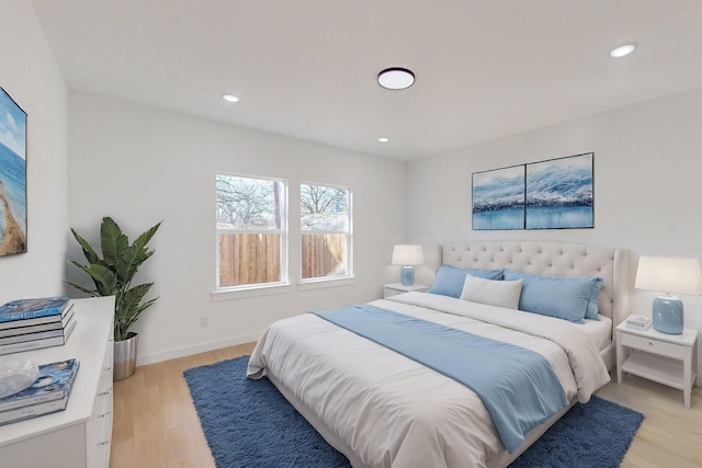 bedroom with light hardwood / wood-style floors