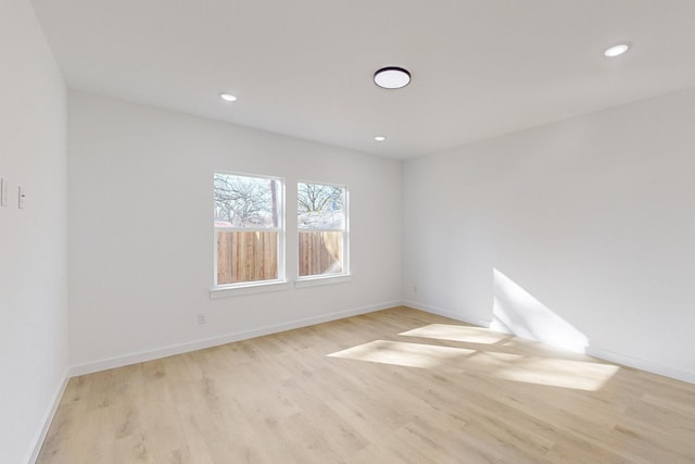 unfurnished room featuring light wood-type flooring