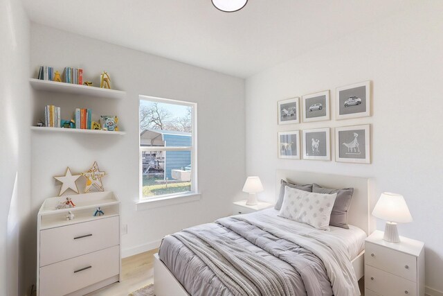 bedroom with light wood-type flooring