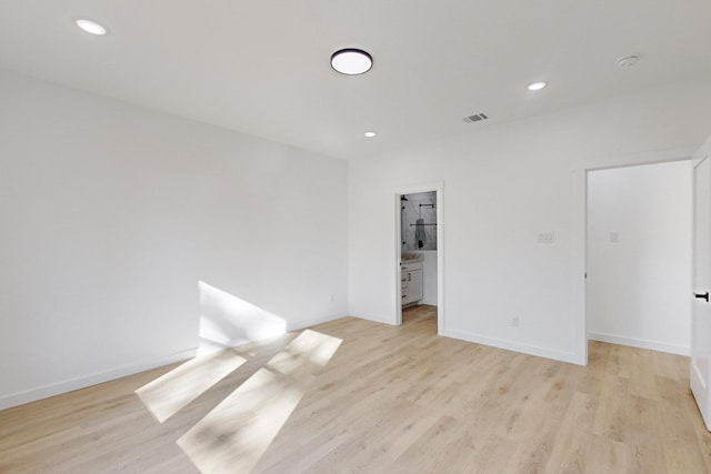 spare room with light wood-type flooring