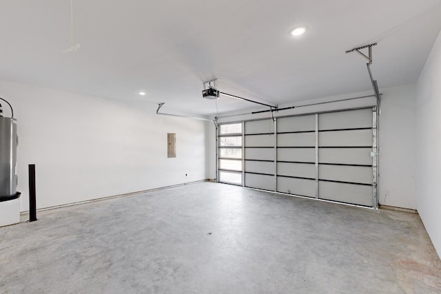 garage featuring electric panel and a garage door opener