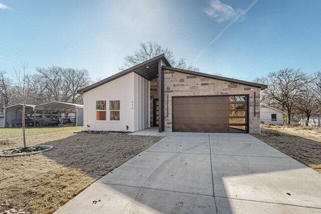 exterior space featuring a carport and a garage