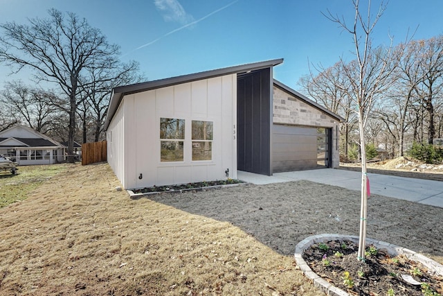 view of property exterior featuring an outbuilding, a garage, and a lawn