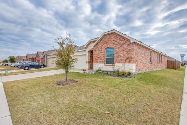 view of front of property featuring a garage and a front lawn