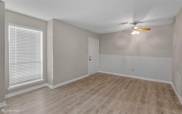 unfurnished room featuring ceiling fan and light wood-type flooring