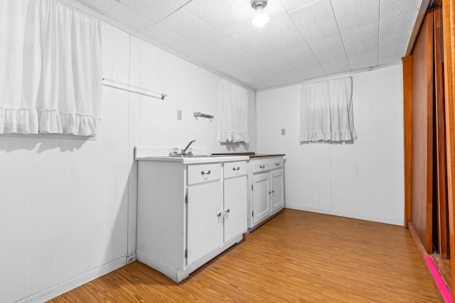 bathroom with hardwood / wood-style flooring and sink